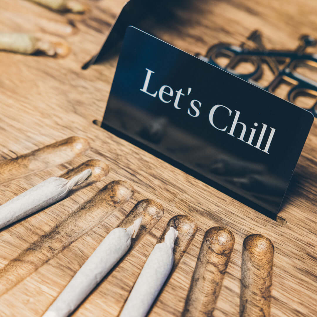 Let’s Chill sign with cannabis joints on Dexter Co serving tray