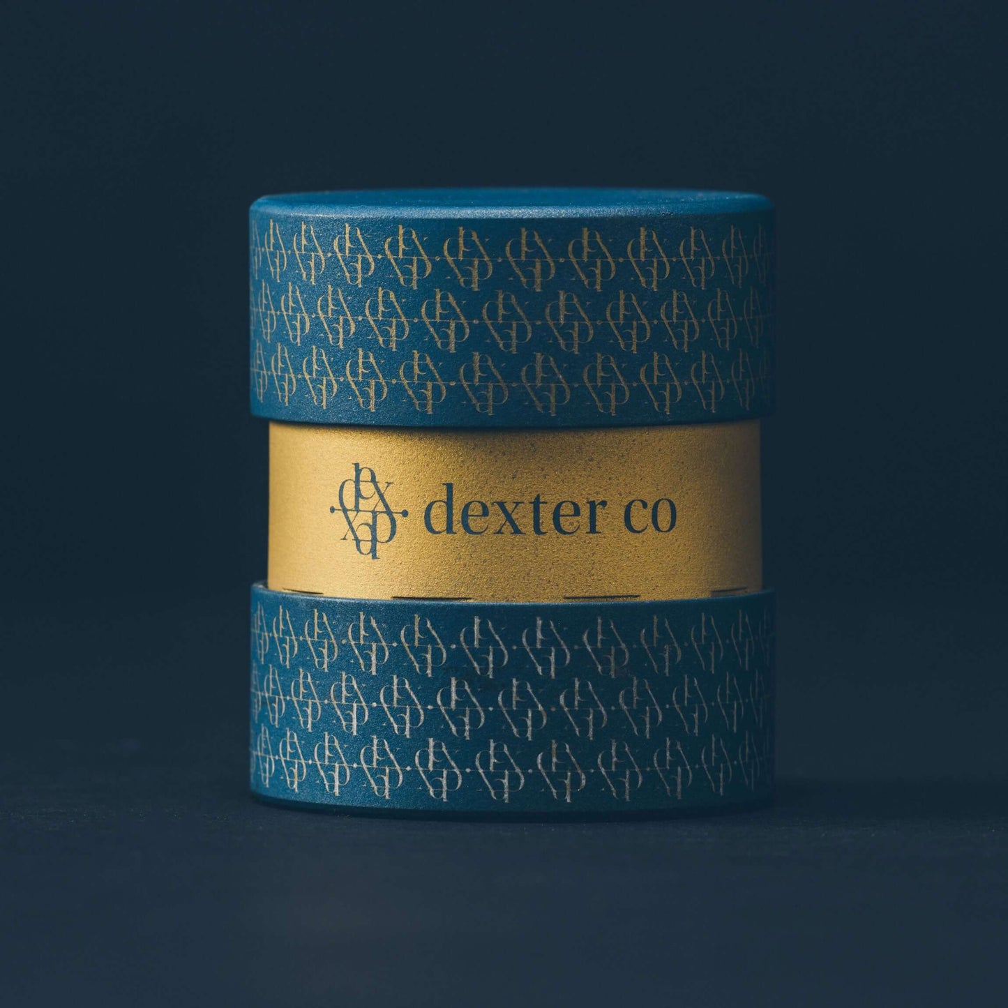Dexter Grinder in slate blue gray with gold accents, showcasing elegant design and artisan craftsmanship.