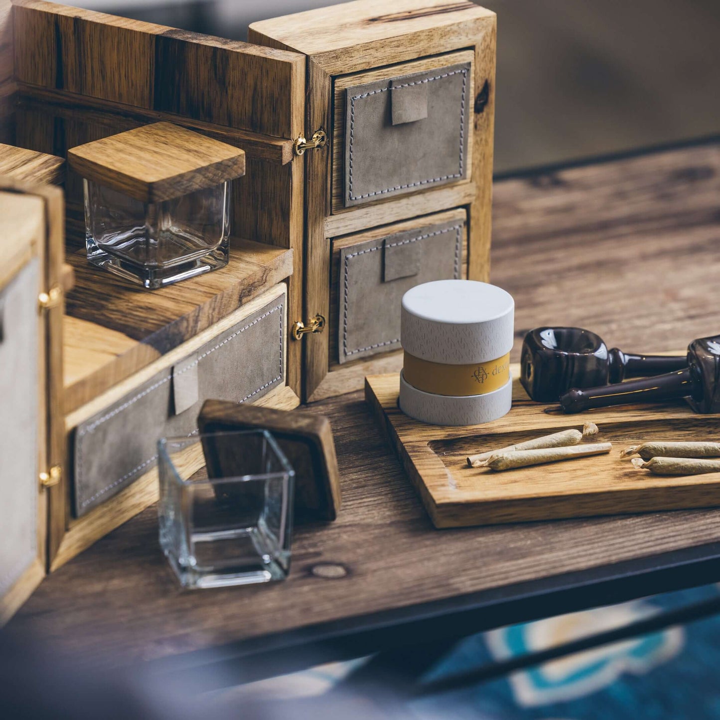 Dexter 10” Cube in natural wood, showcasing luxury cannabis storage with custom grinder and rolling tray.