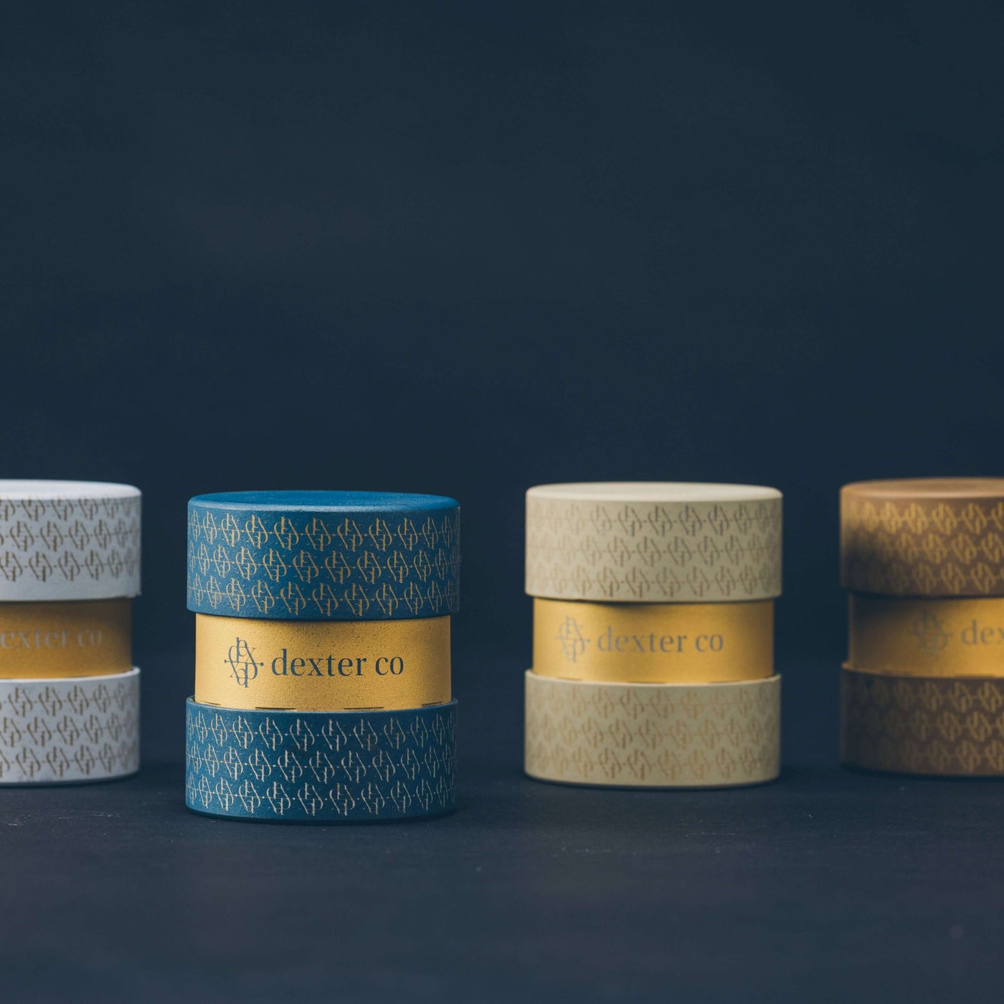 Elegant packaging of Dexter products in various colors, showcasing luxury cannabis accessories with refined designs.