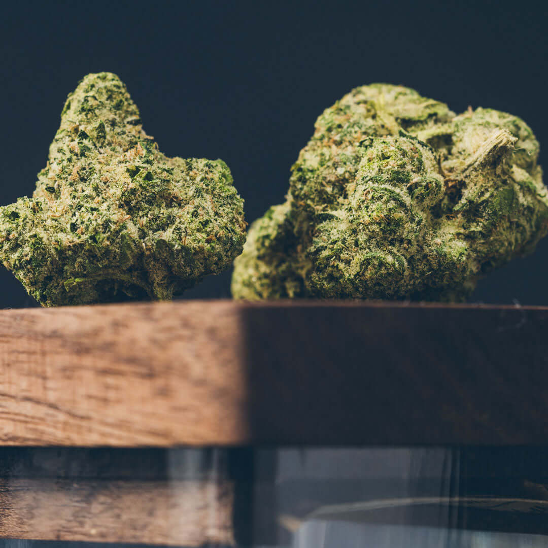 Cannabis flower displayed on Dexter Co wooden storage lid