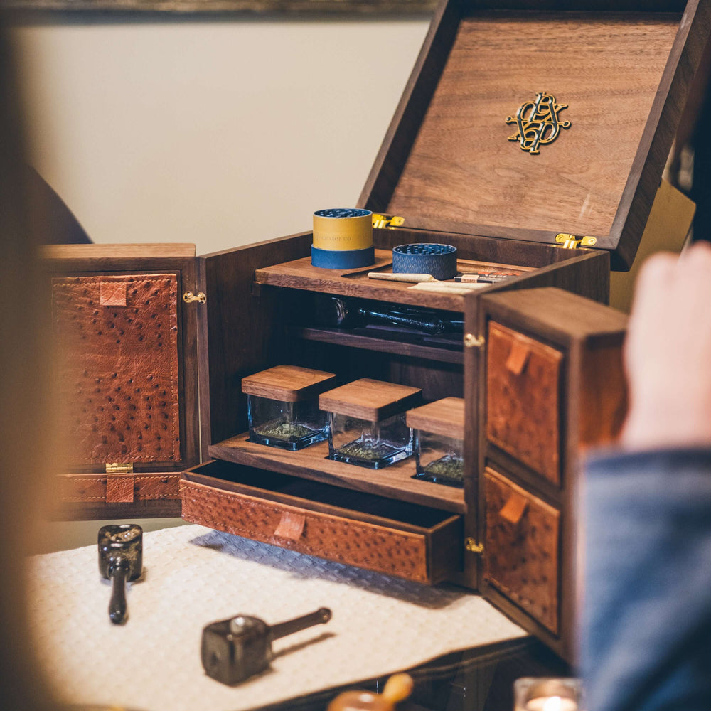 Dexter 12" Cube: luxury cannabis storage with integrated compartments and handcrafted design, featuring artisan strain jars and elegant storage.