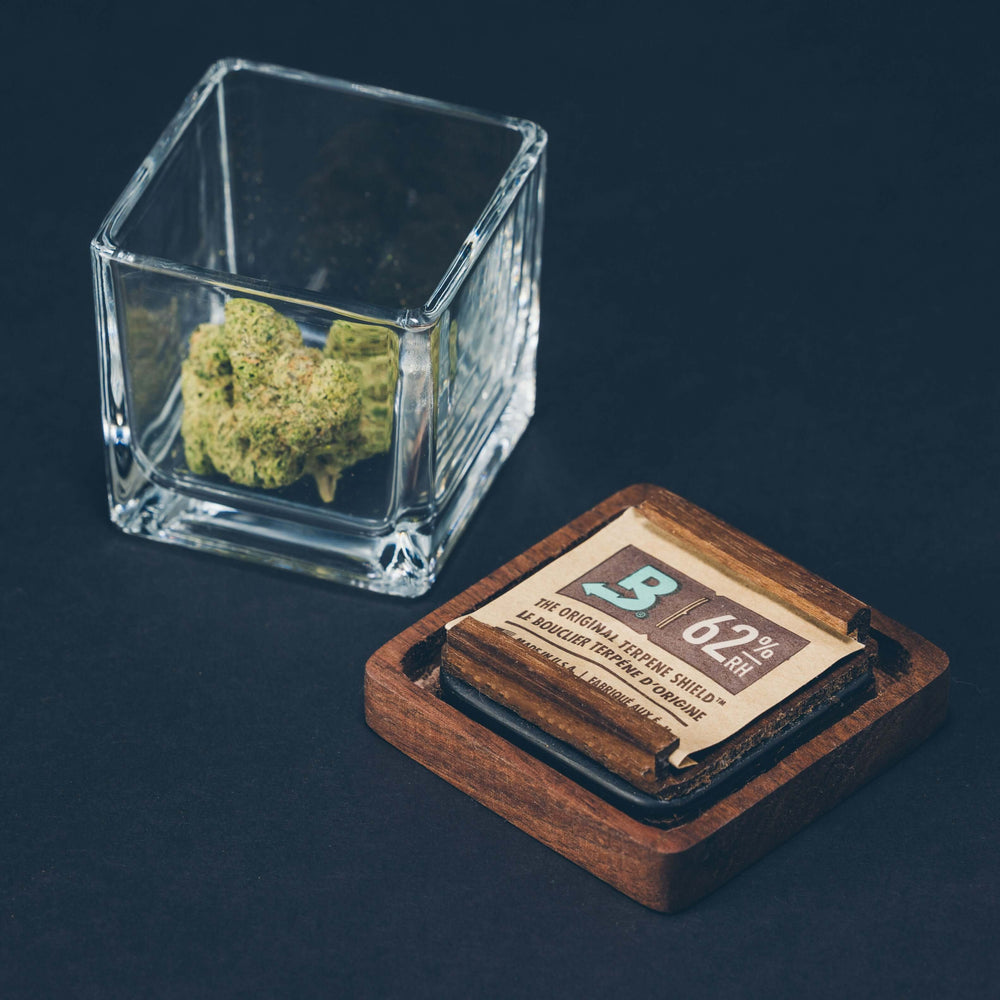 Elegant artisanal strain jar with premium wooden lid for stylish cannabis storage and flower preservation.